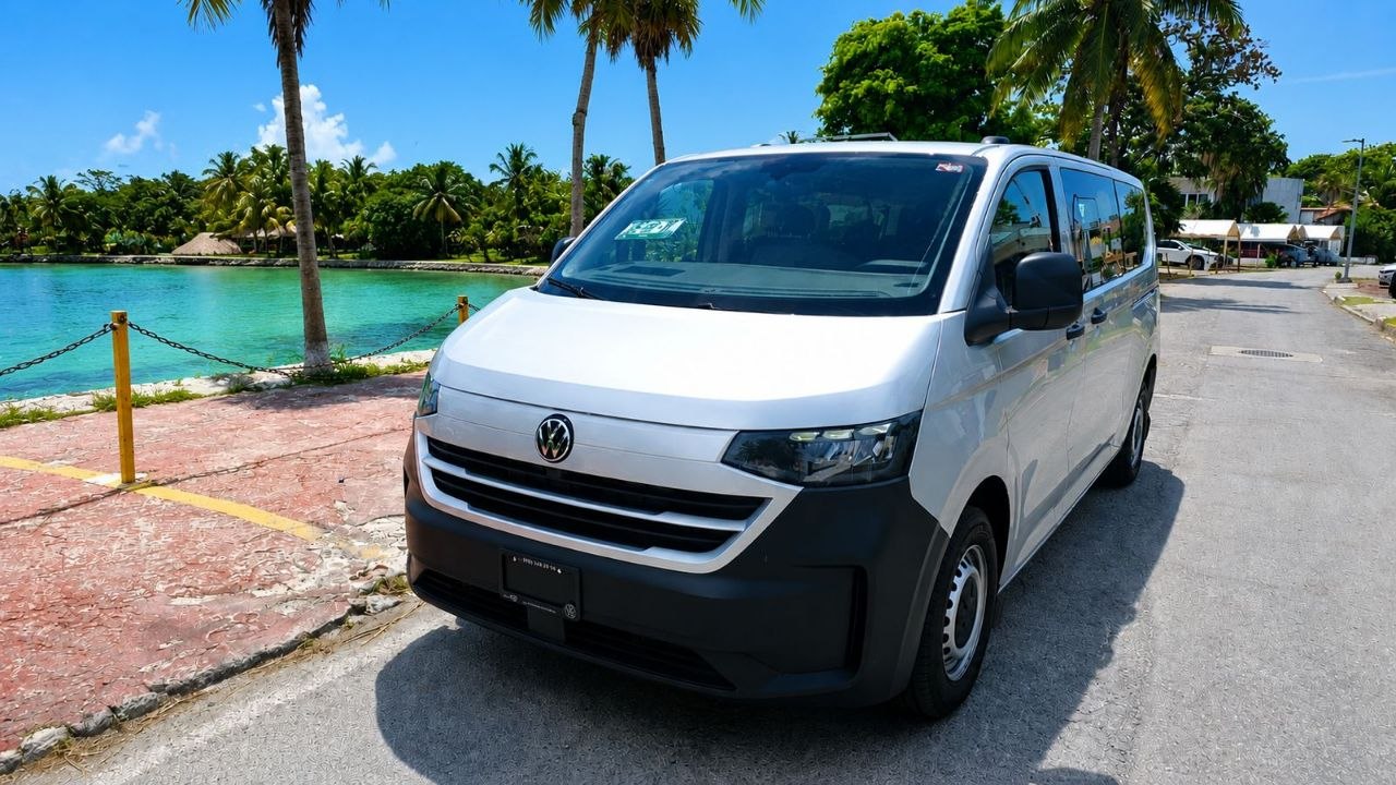 Private van beside a turquoise lagoon in the Riviera Maya